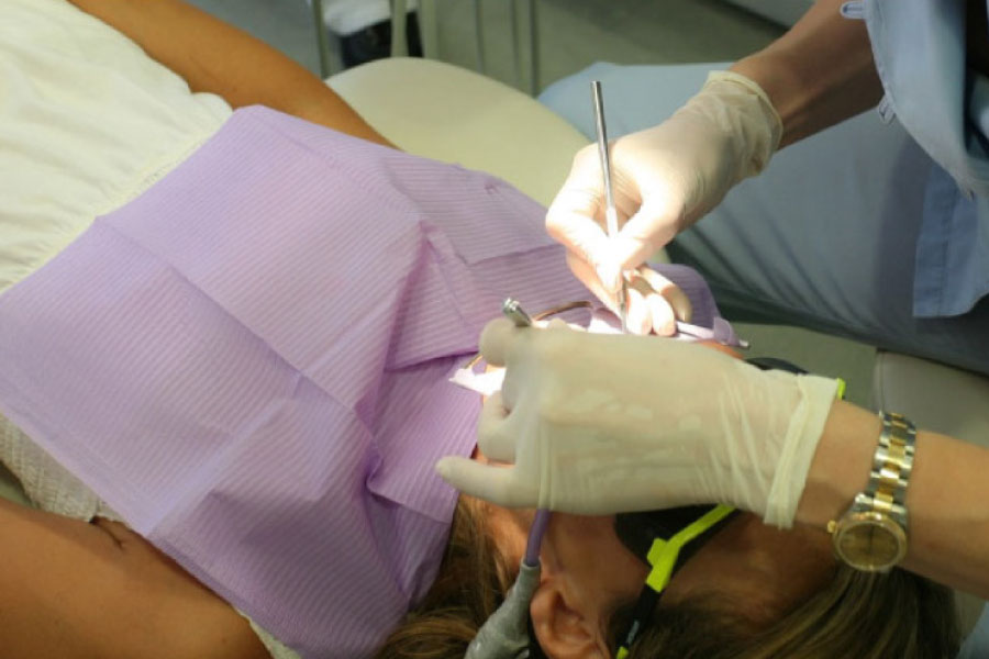 dental patient undergoing root canal surgery