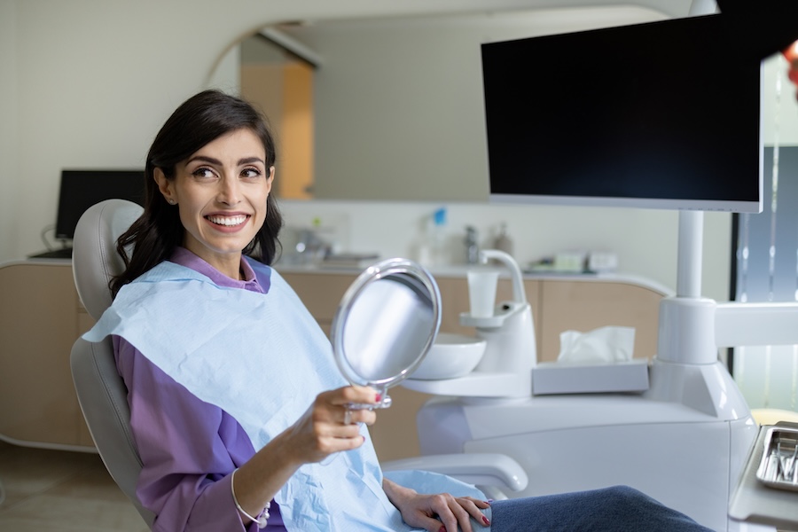 woman smiling after cosmetic dentistry